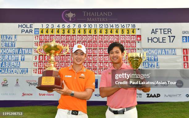 Jazz Janewattananond of Thailand and top amateur Tananpat Pichaikool of Thailand pose with their winner's trophy during the final round of the...