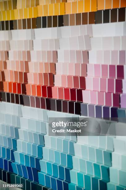 color swatches on wall in hardware store - color chart stock-fotos und bilder