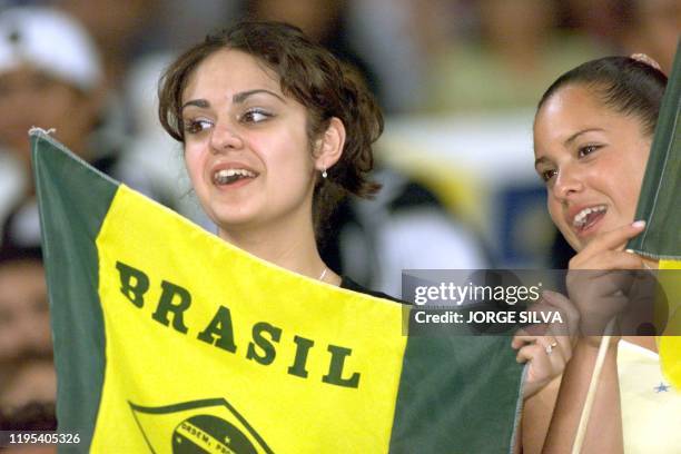 Two Mexican fans attend the 28 July 1999 soccer match betwenn Brazil and the US in Guadalajar. Hinchas mexicanas asisten al partido entre las...