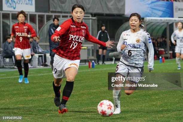 Miki Ito of INAC Kobe Leonessa and Yuzuho Shiokoshi of Urawa Red Diamonds compete for the ball during the Empress Cup 41st JFA Women's Championship...