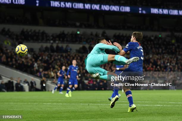 Paulo Gazzaniga of Tottenham Hotspur collides with Marcos Alonso of Chelsea in the area which results in a penalty awarded to Chelsea during the...