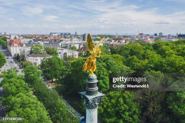 germany, bavaria, munich, aerial view of gold colored†angel of peace monument - munich drone stock pictures, royalty-free photos & images