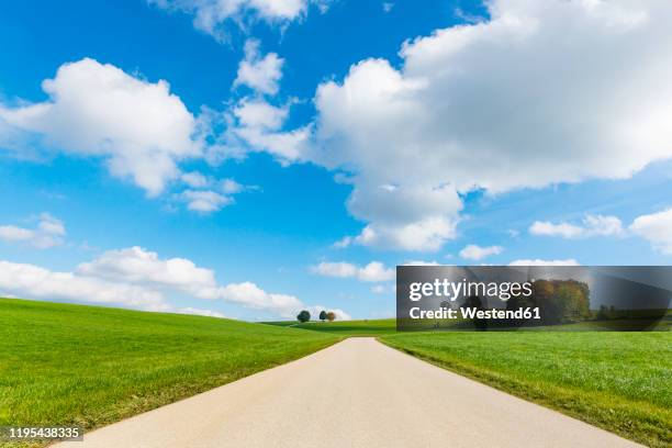 germany, upper bavaria, dirt road crossing fields between holzhausen and degerndorf - country road stock pictures, royalty-free photos & images