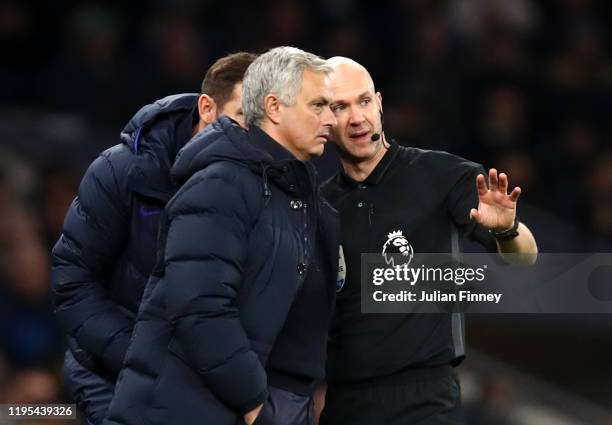 Anthony Taylor explains reported racism to Jose Mourinho, Manager of Tottenham Hotspur during the Premier League match between Tottenham Hotspur and...