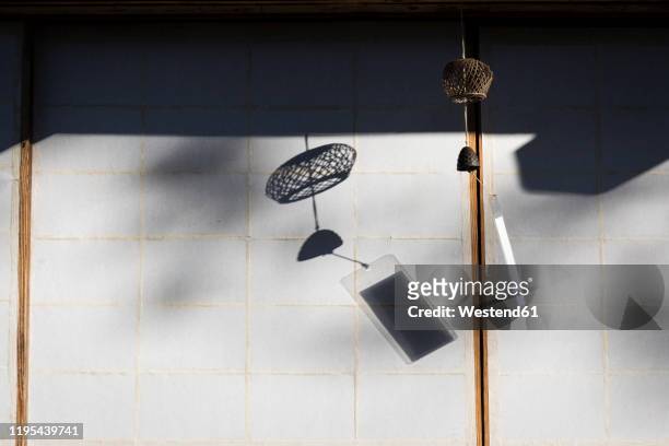 japan, takayama, traditional wind chime hanging in front of house in hida folk village - wind chime stock pictures, royalty-free photos & images