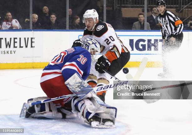 Henrik Lundqvist of the New York Rangers makes the first period save on Nicolas Deslauriers of the Anaheim Ducks at Madison Square Garden on December...