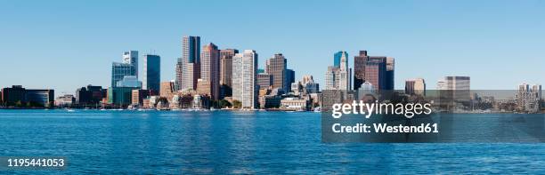 usa,†massachusetts, boston, coastal skyline of financial district skyscrapers - boston massachusetts skyline stock pictures, royalty-free photos & images