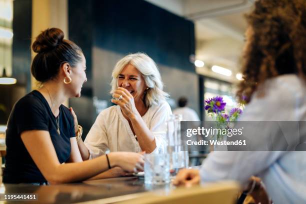 women meeting in bistro, having fun - mature women cafe stock pictures, royalty-free photos & images