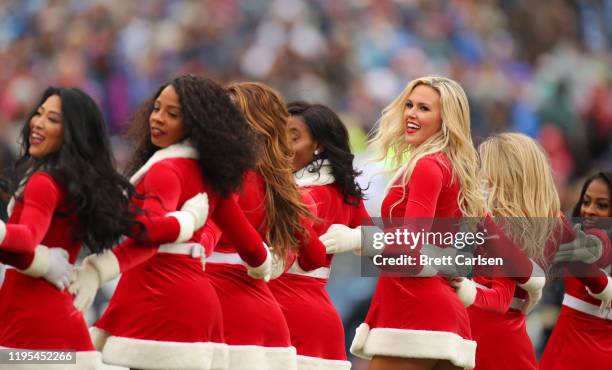 Tennessee Titans cheerleaders in Santa Claus outfits during the second half against the New Orleans Saints in the game at Nissan Stadium on December...