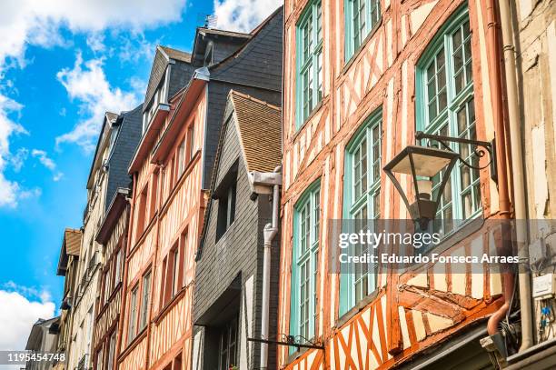 half-timbered houses in the medieval town of rouen against a clear blue sky - rouen fotografías e imágenes de stock