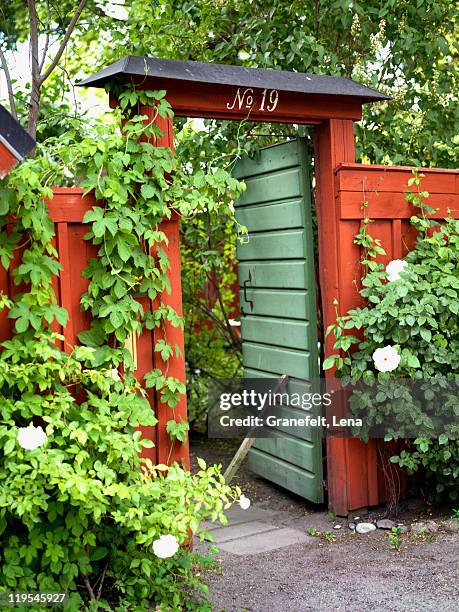 opened gate leading to back yard - garden path stock pictures, royalty-free photos & images