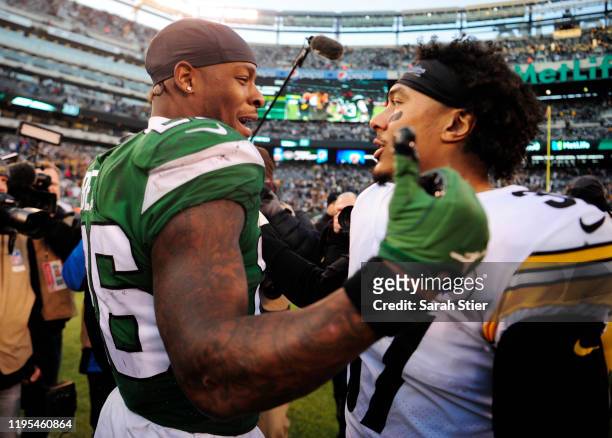 Le'Veon Bell of the New York Jets greets Jordan Dangerfield of the Pittsburgh Steelers after the game at MetLife Stadium on December 22, 2019 in East...