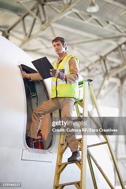 aircraft worker checking airplane - ground crew stock pictures, royalty-free photos & images