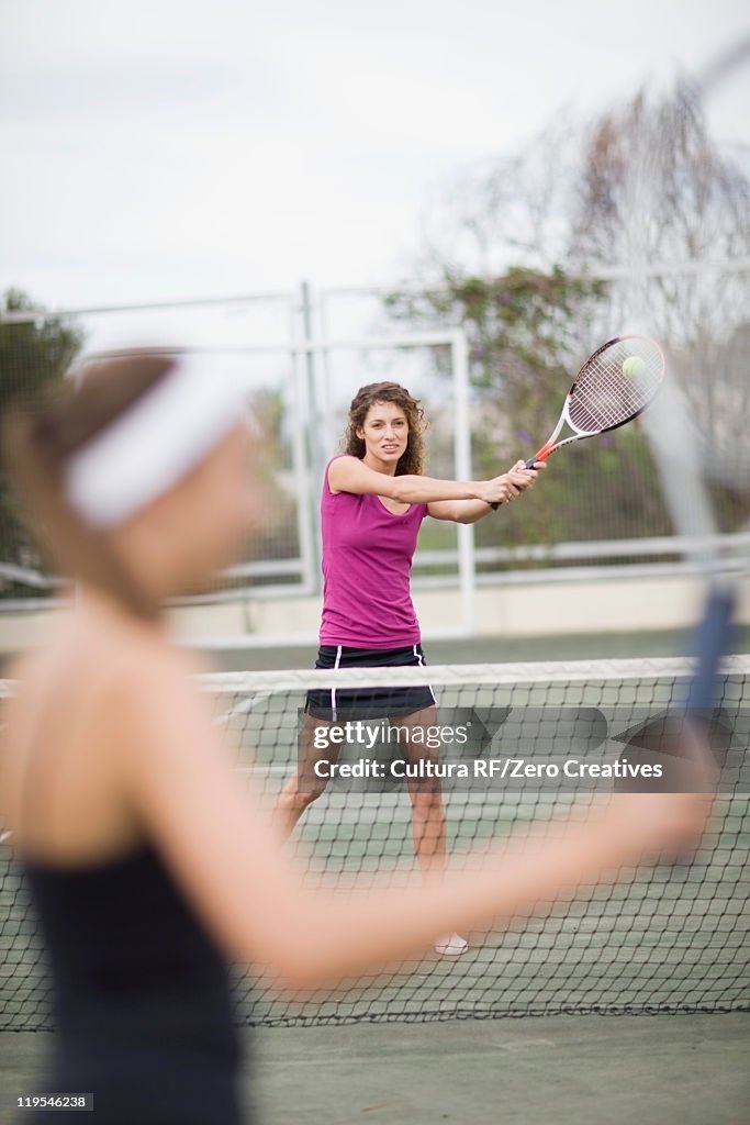 Serious girl playing tennis