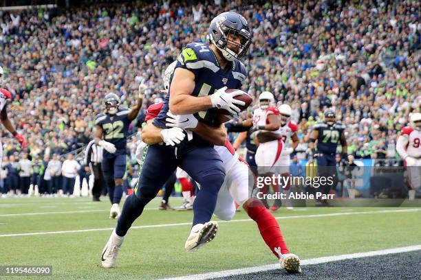 Running back Nick Bellore of the Seattle Seahawks rushes for a touchdown over Arizona Cardinals in the first quarter of the game at CenturyLink Field...