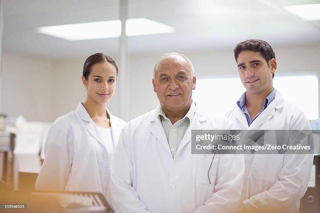 Scientists standing together in lab