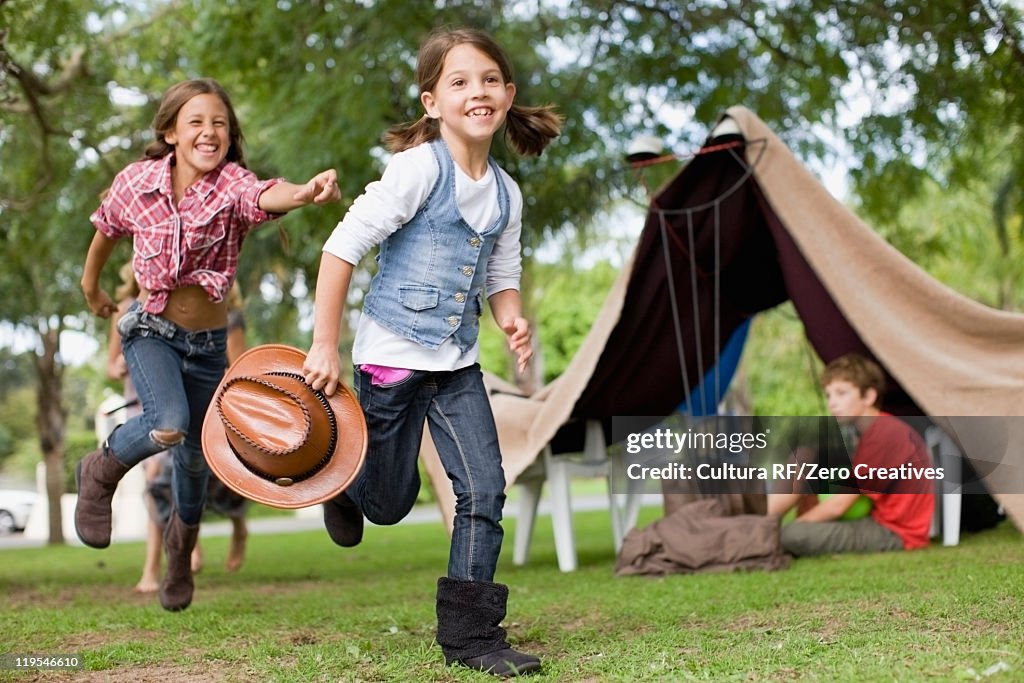 Girls playing together in backyard