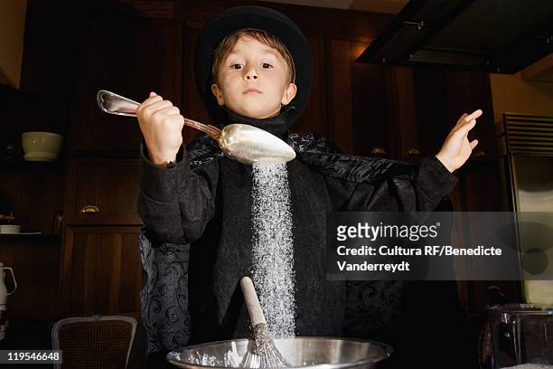 boy magician cooking in kitchen - cooking show stock-fotos und bilder