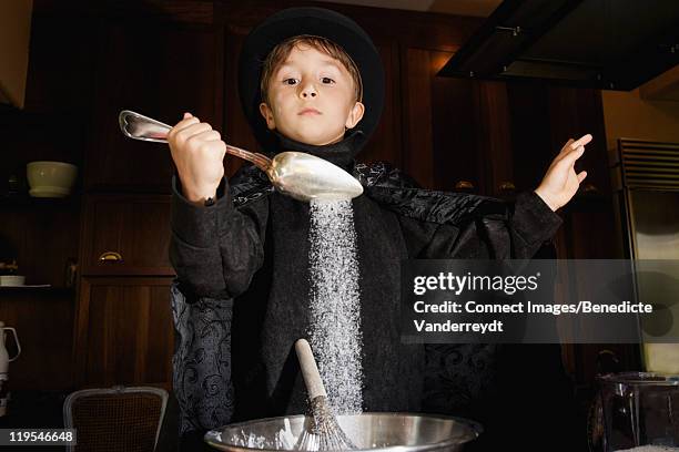 Boy Magician Cooking In Kitchen, Foto de stock