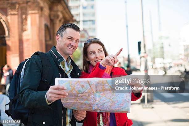 couple with map sightseeing in city - map copenhagen stock pictures, royalty-free photos & images