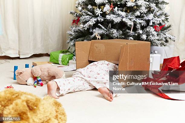 child opening christmas present - lower bildbanksfoton och bilder