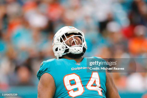 Christian Wilkins of the Miami Dolphins celebrates after a sack against the Cincinnati Bengals during the third quarter at Hard Rock Stadium on...