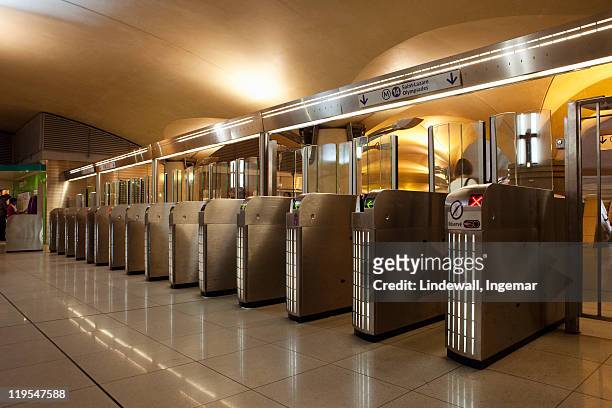 turnstiles at subway station - paris metro stock pictures, royalty-free photos & images