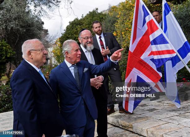 Britain's Prince Charles and Israeli President Reuven Rivlin talk after planting a tree outside the presidential residence in Jerusalem, ahead of a...