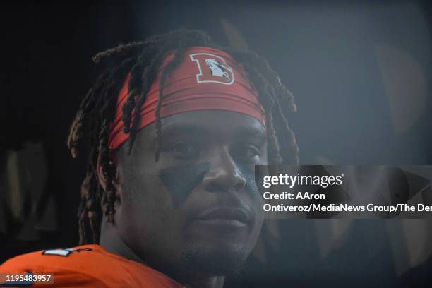 Josh Watson of the Denver Broncos watches the final minutes against the Detroit Lions during the fourth quarter of Denver's 27-17 on Sunday, December...