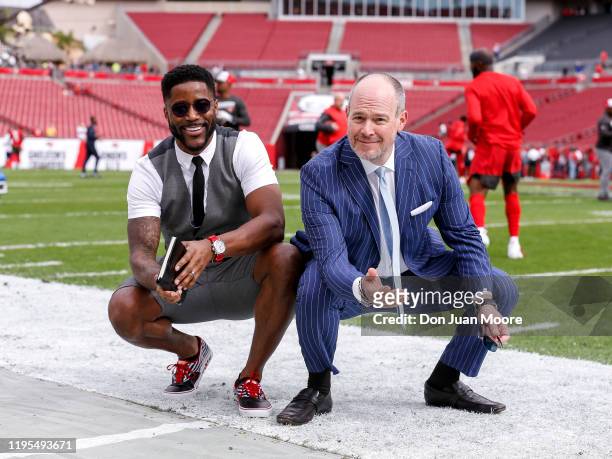 Network Commentators Nate Burleson and Rich Eisen poses on the field before the Tampa Bay Buccaneers host the Houston Texans at Raymond James Stadium...