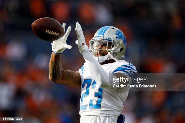 Cornerback Darius Slay of the Detroit Lions catches a pass during warm ups before a game against the Denver Broncos at Empower Field at Mile High on...