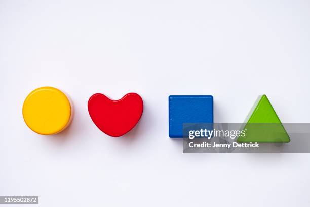 wooden block shapes - geometric heart stock pictures, royalty-free photos & images