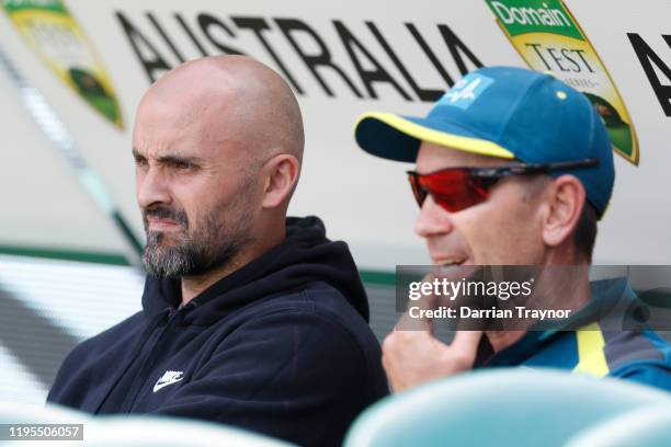 Rhyce Shaw, Senior Coach of the Kangaroos in the AFL speaks with Australian Cricket Coach Justin Langer during an Australia nets session at the...