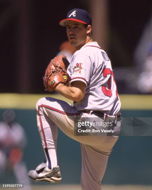 Greg Maddux of the Atlanta Braves pitches during an MLB game versus the San Francisco Giants at Candlestick Park in San Francisco, California during...