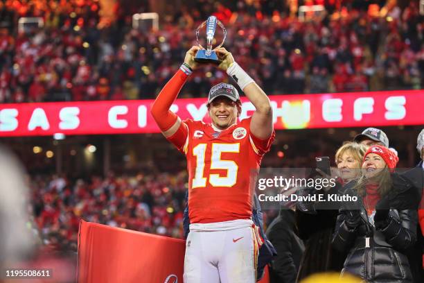 Playoffs: Kansas City Chiefs QB Patrick Mahomes victorious, holding up Lamar Hunt trophy after winning game vs Tennessee Titans at Arrowhead Stadium....