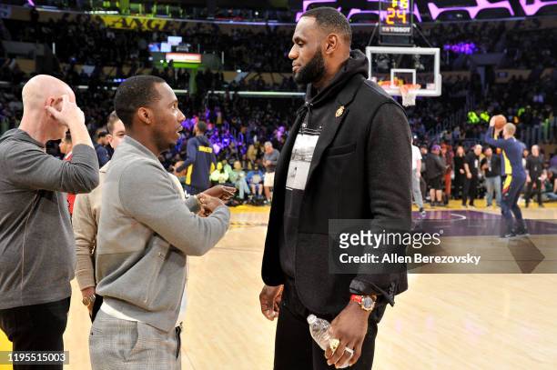 Rich Paul and LeBron James talk during halftime of a basketball game between the Los Angeles Lakers and the Denver Nuggets at Staples Center on...