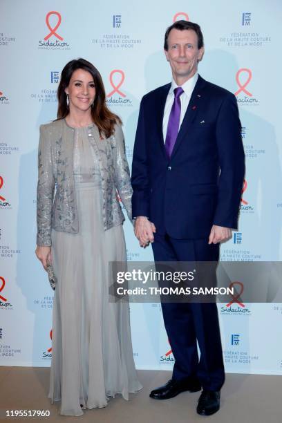 Princess Marie and Prince Joachim of Denmark pose during a photocall upon their arrival to the Diner de la Mode , a fundraiser dinner in profit of...