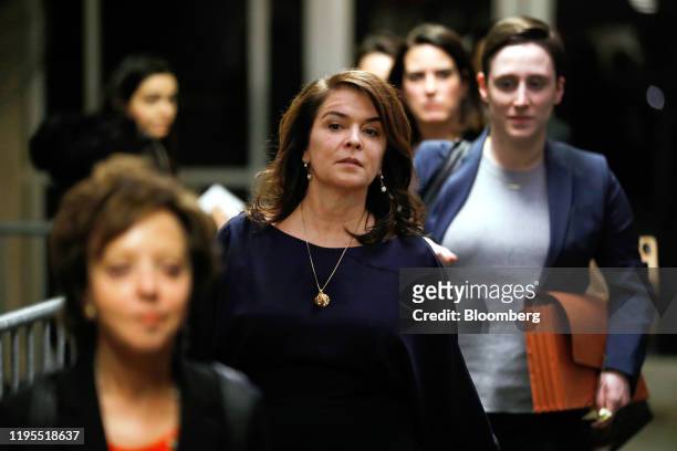 Actress Annabella Sciorra, center, exits the court room during a break at state supreme court in New York, U.S., on Thursday, Jan. 23, 2020. Harvey...