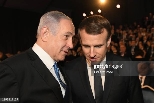 Israeli Prime Minister Benjamin Netanyahu speaks with French President Emmanuel Macron at the 5th World Holocaust Forum at Yad Vashem Holocaust...