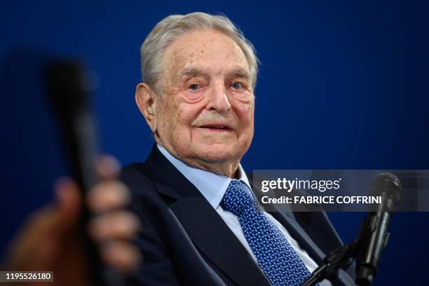 Hungarian-born US investor and philanthropist George Soros looks on after having delivered a speech on the sidelines of the World Economic Forum...