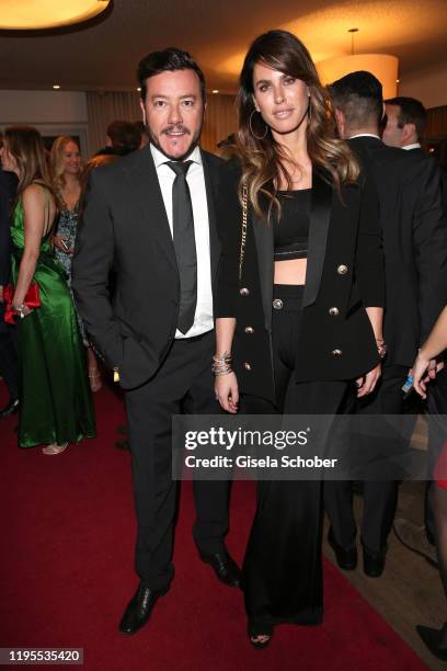 Rene Benko and his wife Nathalie Benko during the Schwarzenegger climate initiative charity dinner prior the Hahnenkamm Ski Races at Country Club on...