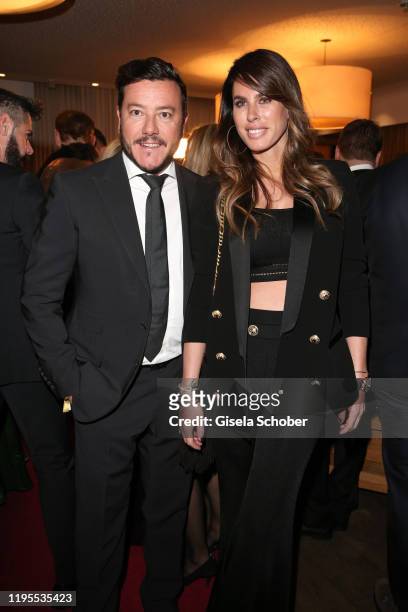 Rene Benko and his wife Nathalie Benko during the Schwarzenegger climate initiative charity dinner prior the Hahnenkamm Ski Races at Country Club on...