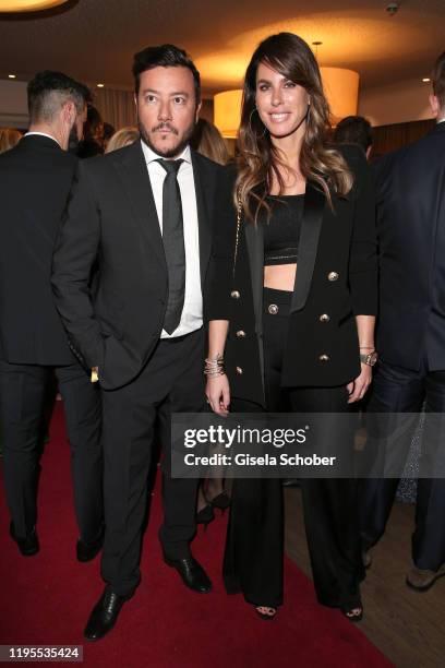 Rene Benko and his wife Nathalie Benko during the Schwarzenegger climate initiative charity dinner prior the Hahnenkamm Ski Races at Country Club on...