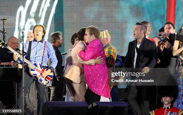 Sir Paul McCartney, Sir Cliff Richard and Sir Elton John and Robbie Williams on stage at The Diamond Jubilee Concert in front of Buckingham Palace...