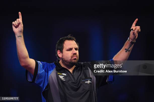Adrian Lewis of England celebrates after winning his Third Round match against Darren Webster of England during Day Eleven of the 2020 William Hill...
