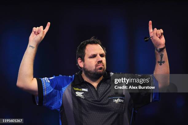 Adrian Lewis of England celebrates after winning his Third Round match against Darren Webster of England during Day Eleven of the 2020 William Hill...