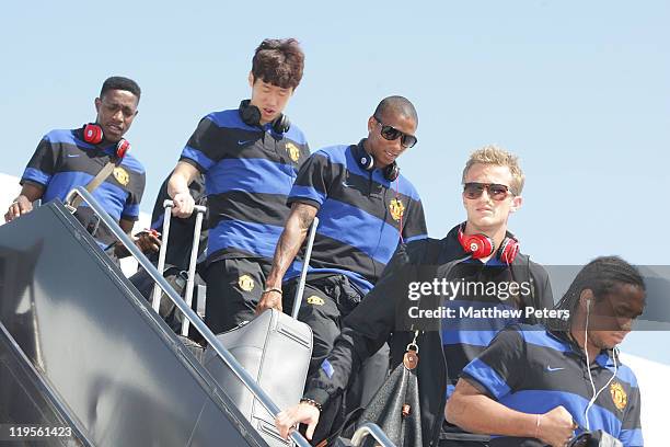 Anderson, Anders Lindegard, Ashley Young, Ji-Sung Park and Danny Welbeck of Manchester United arrive at the airport ahead of their pre-season match...