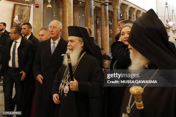 Britain's Prince Charles walks along Theophilos III , the Greek Orthodox Patriarch of Jerusalem, during a visit to the Church of the Nativity in...
