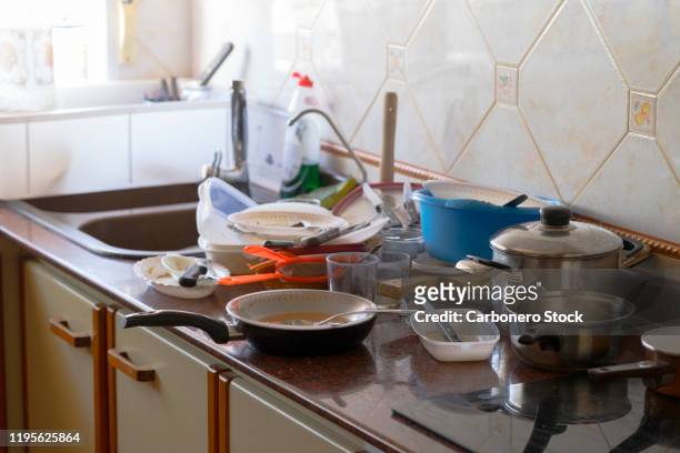 kitchen piled over with dirty dishes - dirty room stock pictures, royalty-free photos & images
