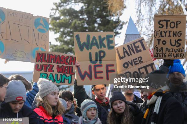 Greta Thunberg, climate activist, center, and Luisa Neubauer, center right, attend a demonstration on the closing day of the World Economic Forum in...